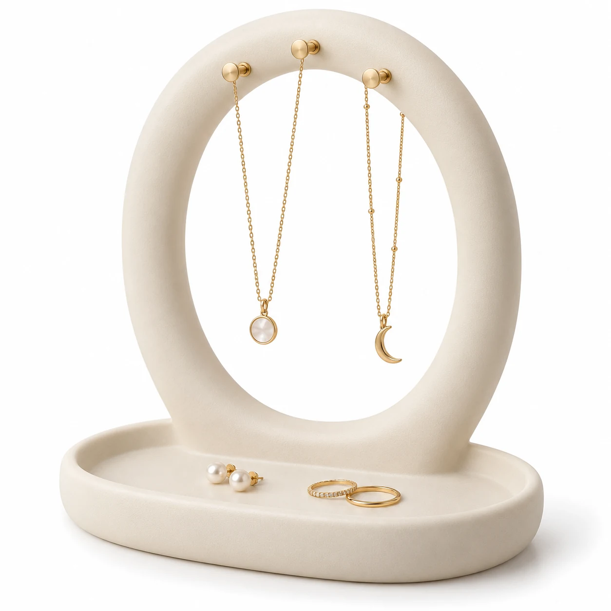 KELIKULI Moon Gate sculptural resin jewelry organizer with three gold-tone pegs and integrated vanity tray, styled with necklaces, pearl earrings and rings on a white background.