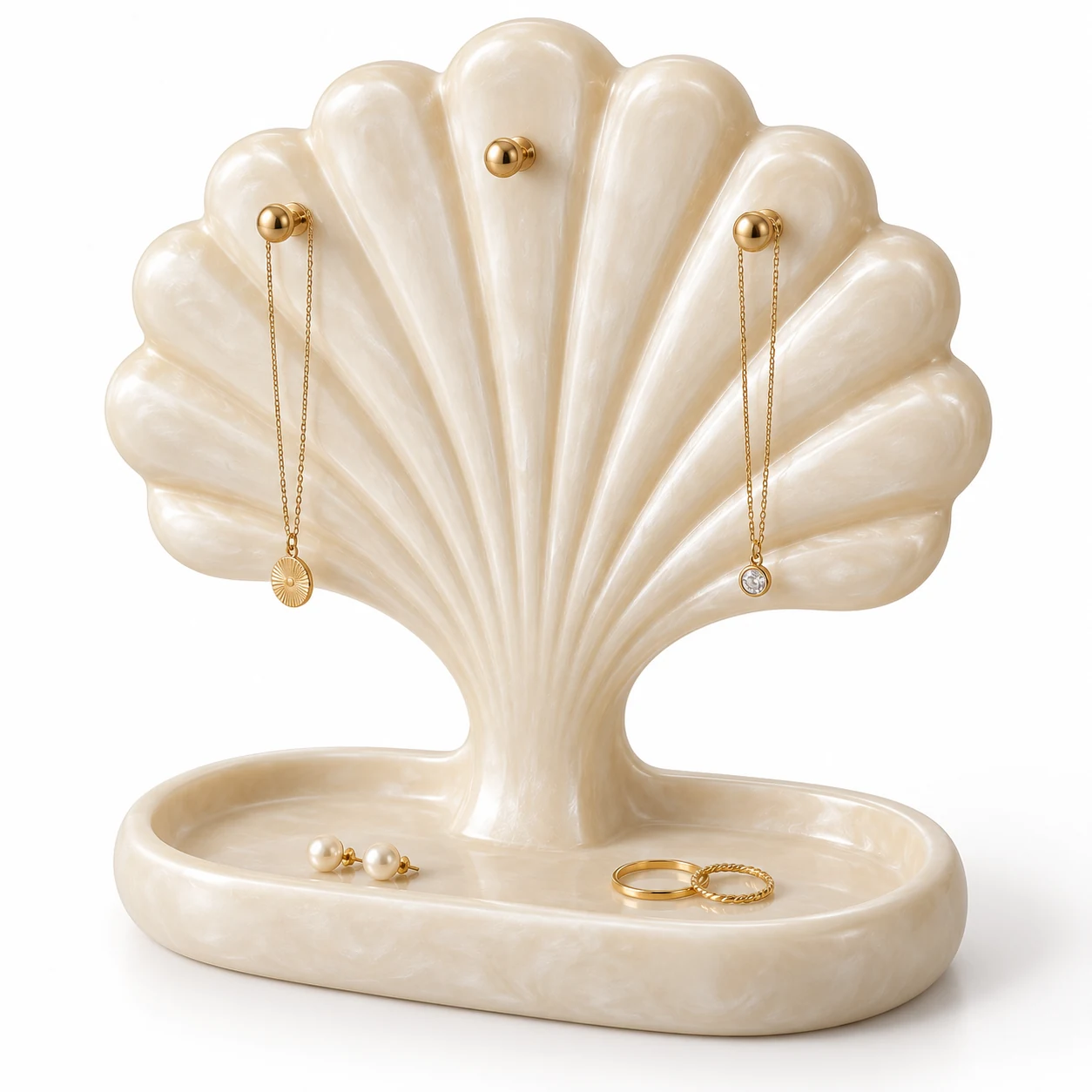 KELIKULI Shell Arc sculptural resin jewelry organizer with three gold-tone pegs and integrated vanity tray, styled with necklaces, pearl earrings and rings on a white background.