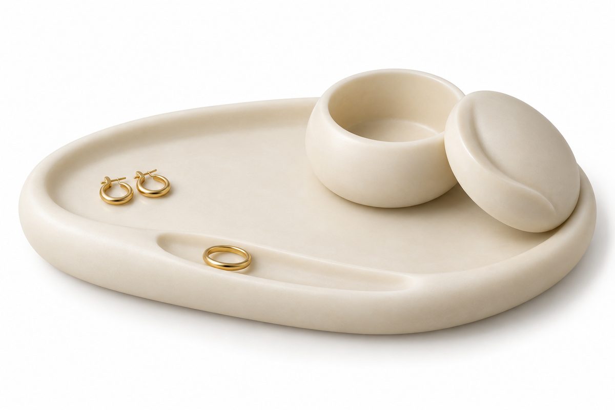 Ivory resin jewelry tray with a matching open mini box and lid on a white background.